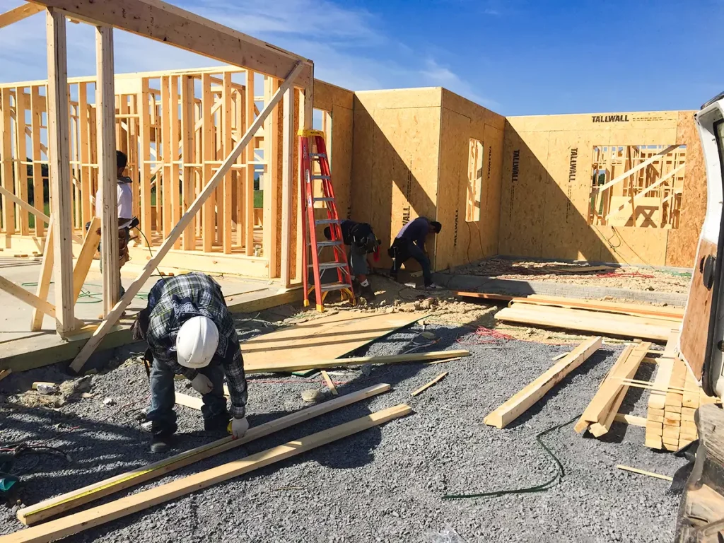 Contractors working to build the of frame a new home.